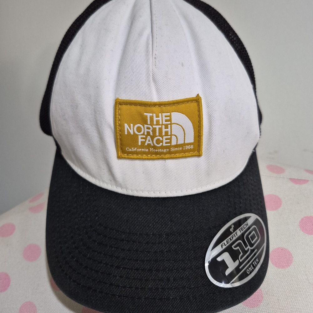 The North Face Black and White Cap with Gold Logo